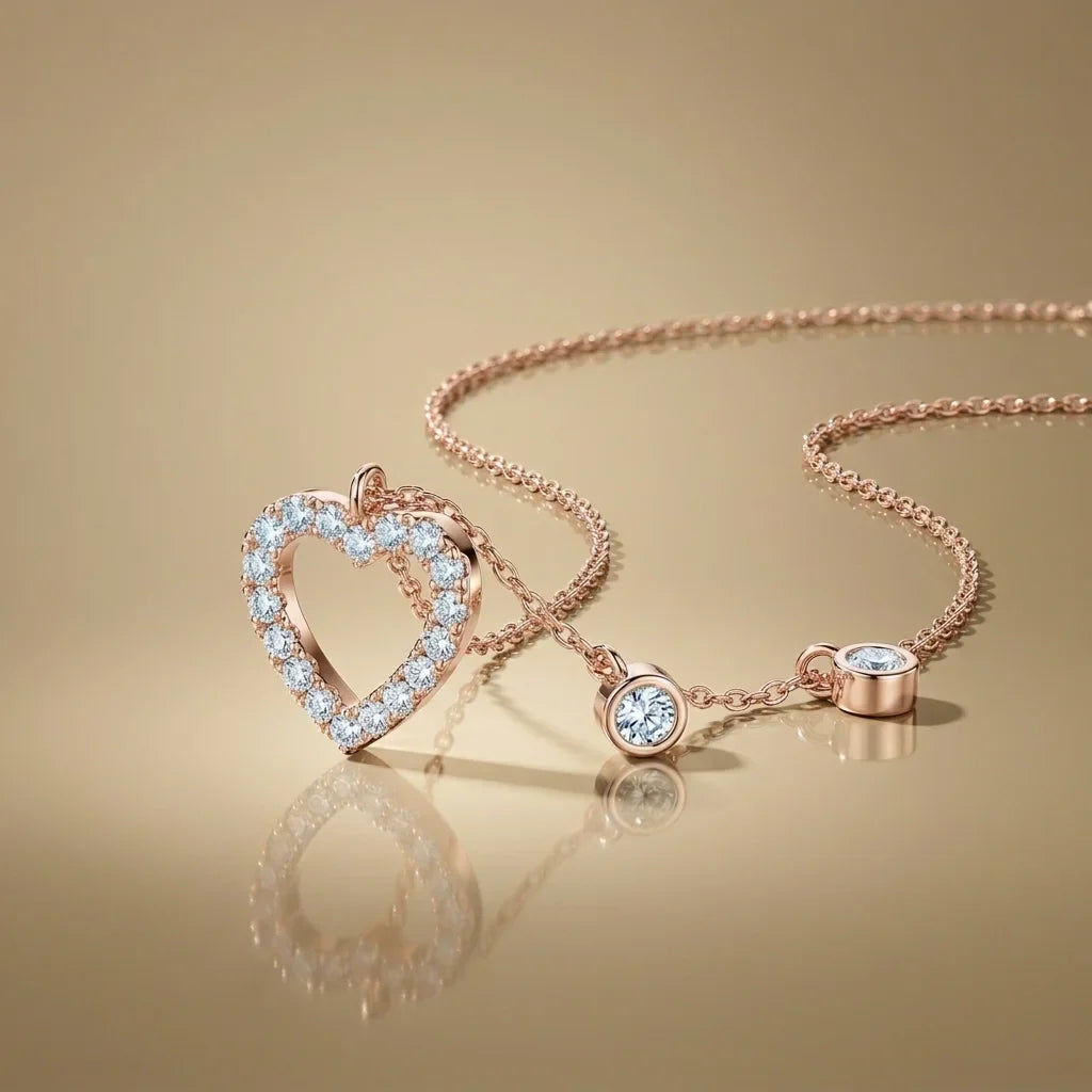 Rose gold necklace with heart pendant and round pendants on a beige background