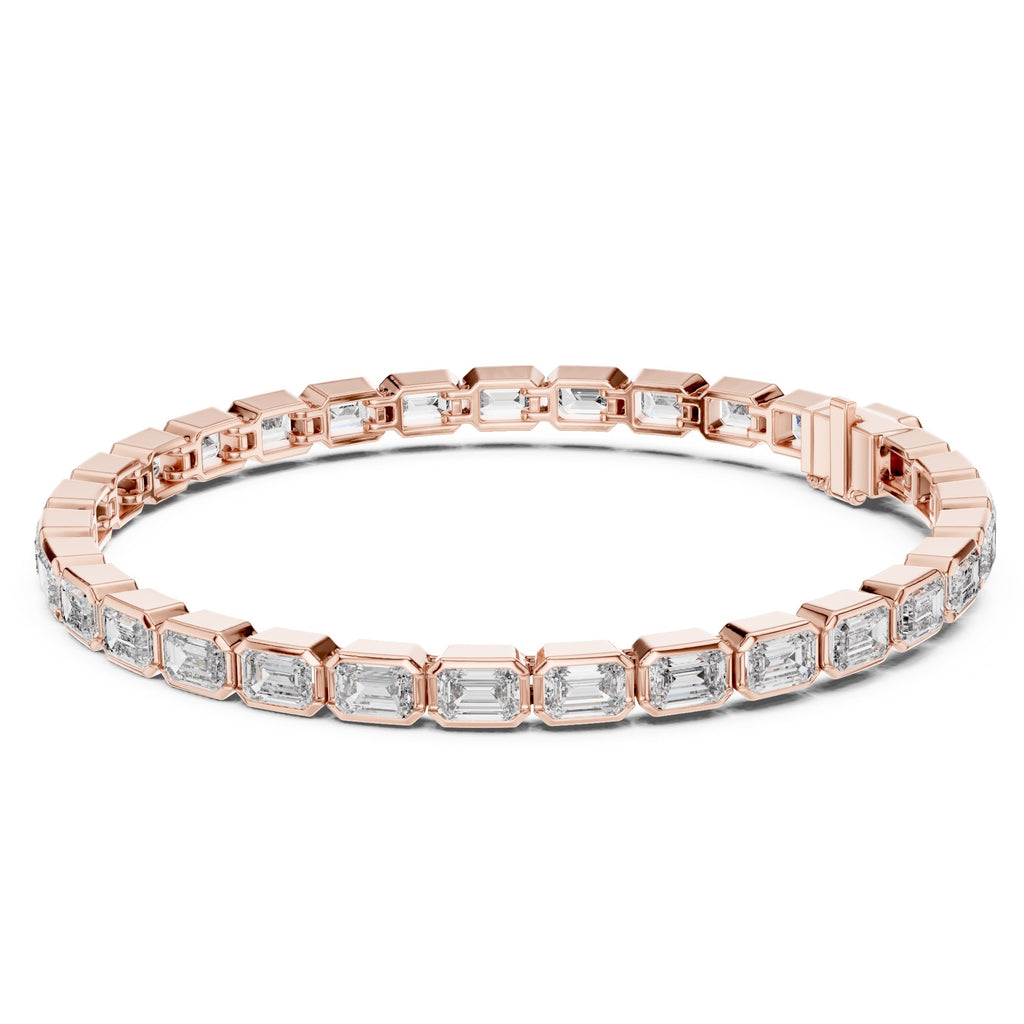 A rose gold tennis bracelet featuring rectangular emerald-shape clear diamonds in a continuous link design, shown against a plain white background.