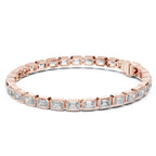 A rose gold tennis bracelet featuring rectangular emerald-shape clear diamonds in a continuous link design, shown against a plain white background.