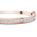 Rose gold bracelet with diamonds on a white background