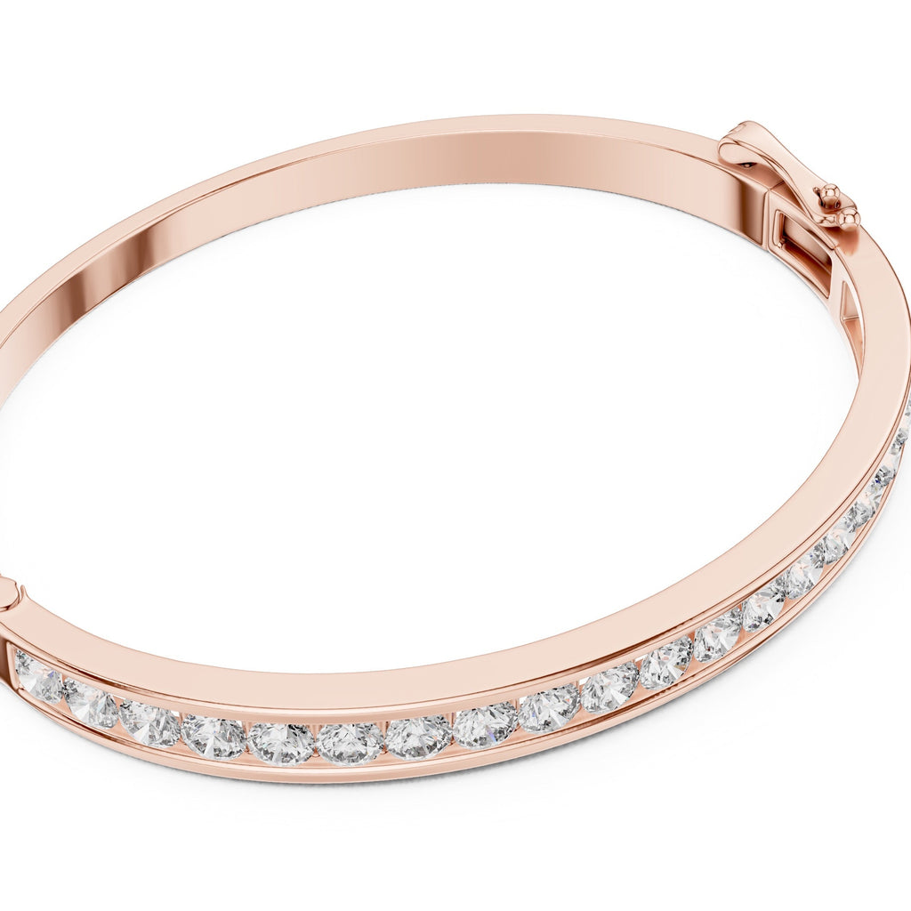 Rose gold bracelet with clear diamonds on a white background