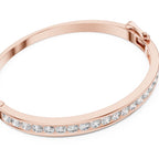 Rose gold bracelet with clear diamonds on a white background