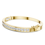 Gold bracelet with diamonds on a white background