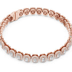Rose gold bracelet with clear diamonds on a white background