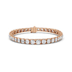 Rose gold bracelet with diamond accents on a white background