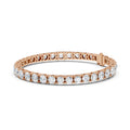 Rose gold bracelet with clear diamonds on a white background