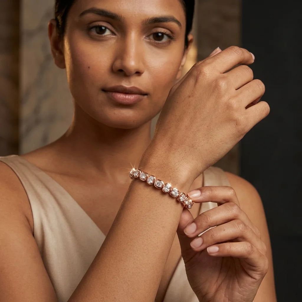 A woman wearing a delicate rose gold tennis bracelet with clear pavé-set diamonds, shown in a close-up portrait against a dark, elegant background.