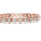 Gold bracelet with diamond accents on a white background