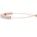 Rose gold bracelet with diamond accents on a white background