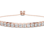 A rose gold tennis bracelet featuring a row of round-cut clear gemstones in a prong setting, displayed on a clean white background.