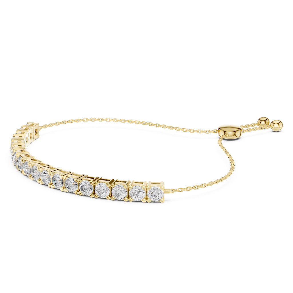 Gold bracelet with diamond accents on a white background