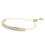 Gold bracelet with diamond accents on a white background