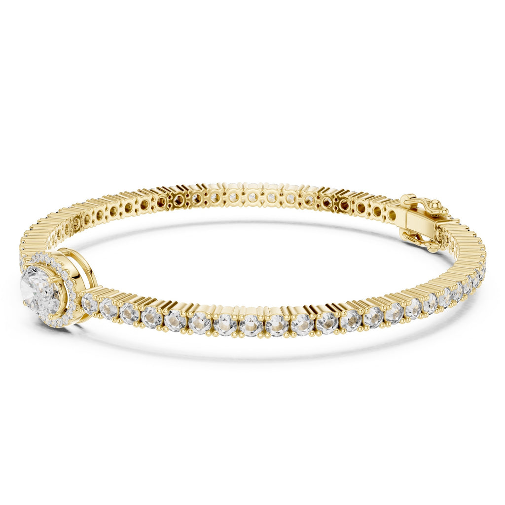 Gold bracelet with diamonds on a white background