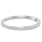 White gold bracelet with clear gemstones on a white background