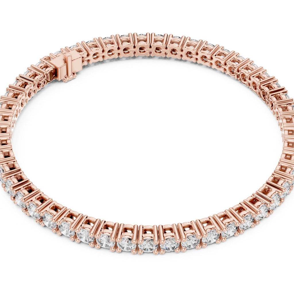 A rose gold tennis bracelet with a continuous line of small clear diamonds, shown on a plain white background.