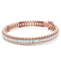 Rose gold bracelet with diamond accents on a white background