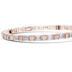 Rose gold bracelet with diamond accents on a white background