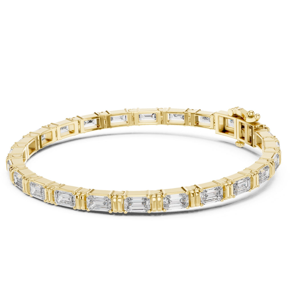 Gold bracelet with diamond accents on a white background