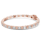 A rose gold tennis bracelet featuring emerald-cut clear diamonds, presented on a clean white background.