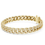 Gold chain bracelet with diamond accents on a white background