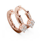 Rose gold hoop earrings with clear gemstones on a white background