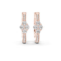 Rose gold earrings with diamond accents on a white background