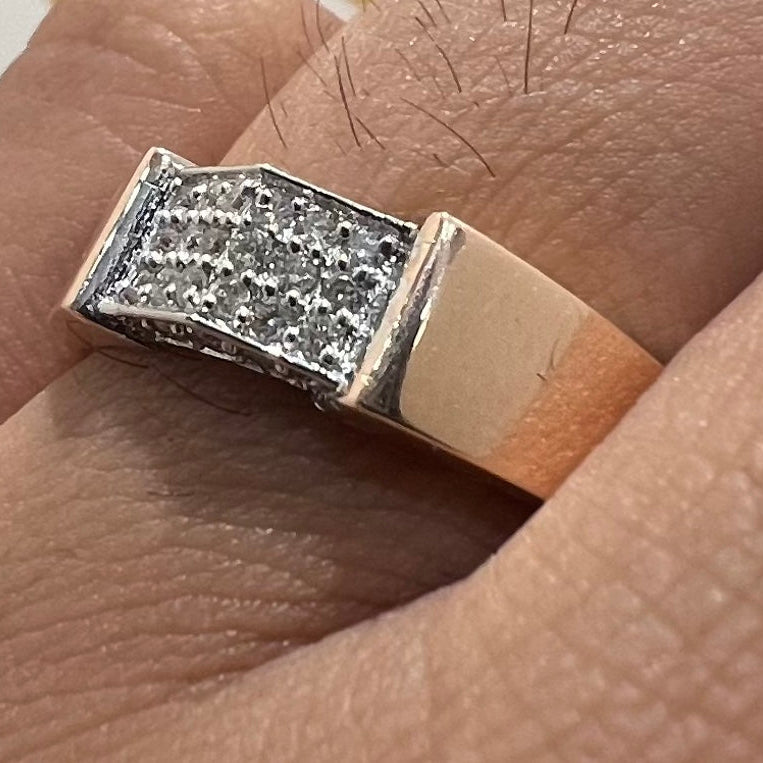 Close-up of a ring with diamond accents on a finger