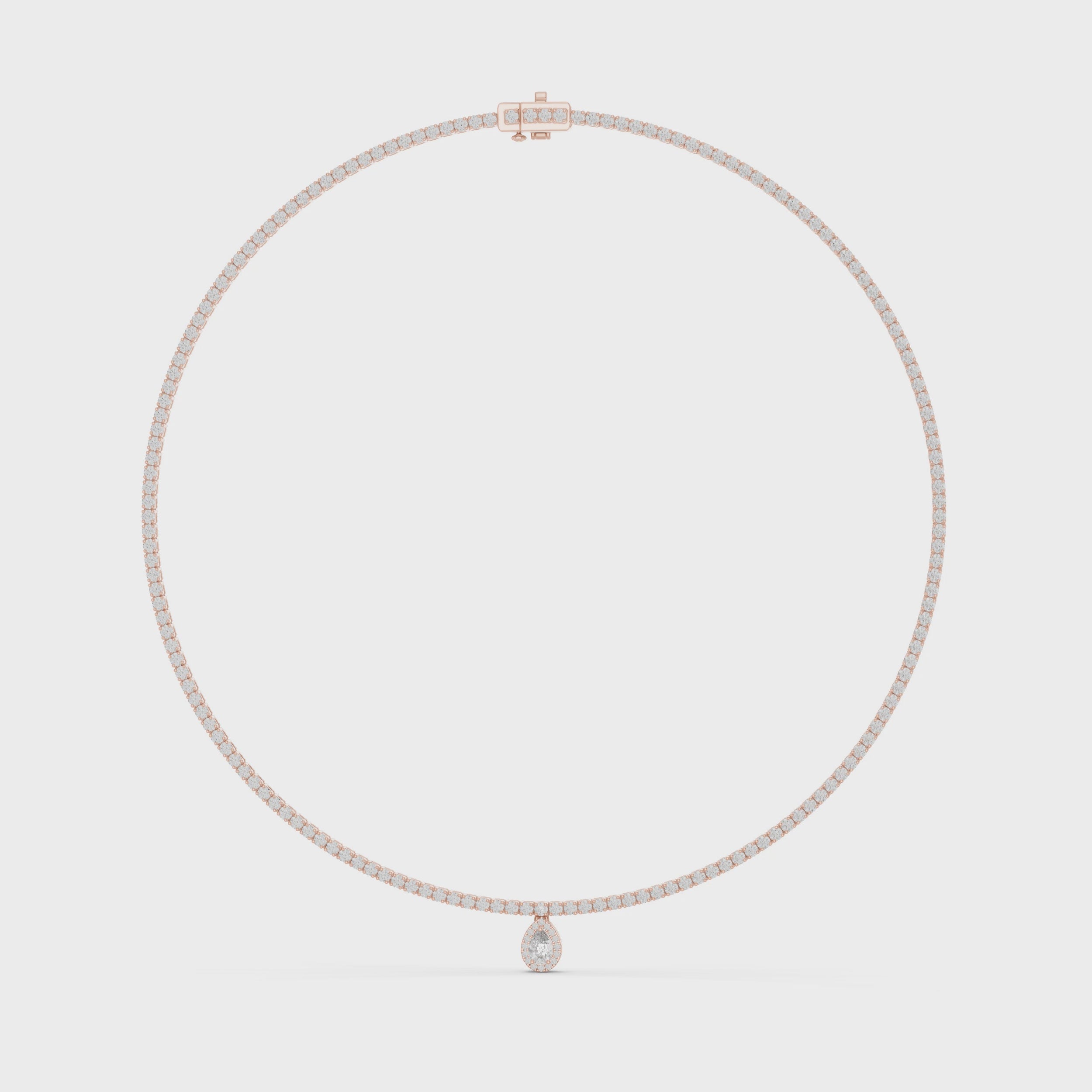 Rose gold diamond tennis necklace with a oval shape pendant is rotating horizontally against the white surface.