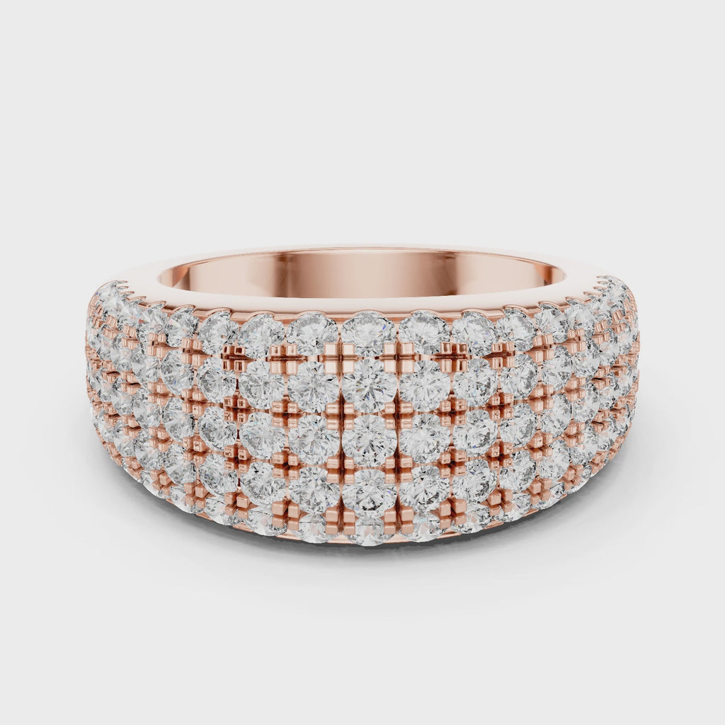 Rose gold ring with multiple row of diamonds on a white background is rotating parallel to the surface.