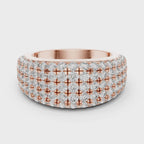 Rose gold ring with multiple row of diamonds on a white background is rotating parallel to the surface.