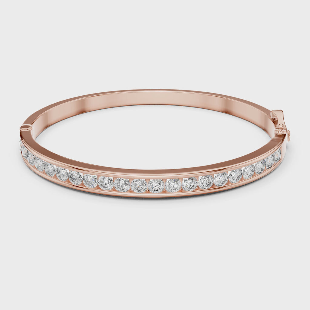 Rose gold bracelet with diamonds on a white background rotating parallel to the surface to show its view from every angle