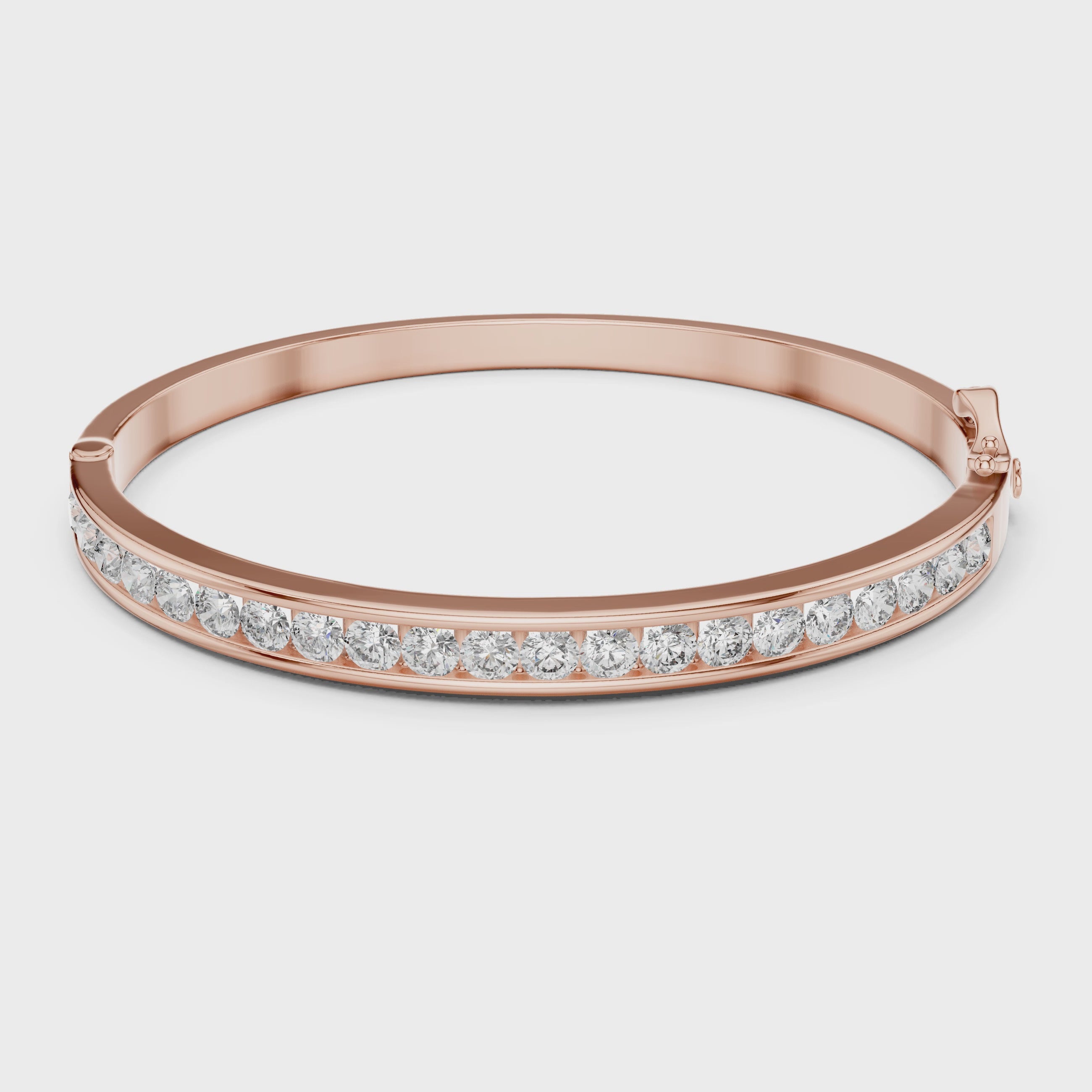 Rose gold bracelet with diamonds on a white background rotating parallel to the surface to show its view from every angle
