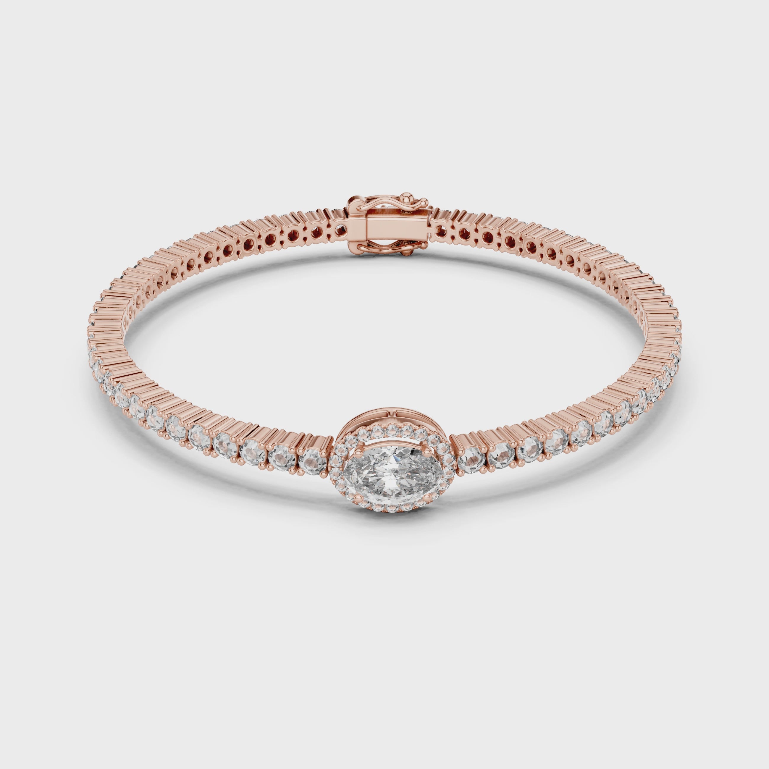 Rose gold bracelet with diamonds on a white surface, is rotating parallel to the surface to show its view from every side.