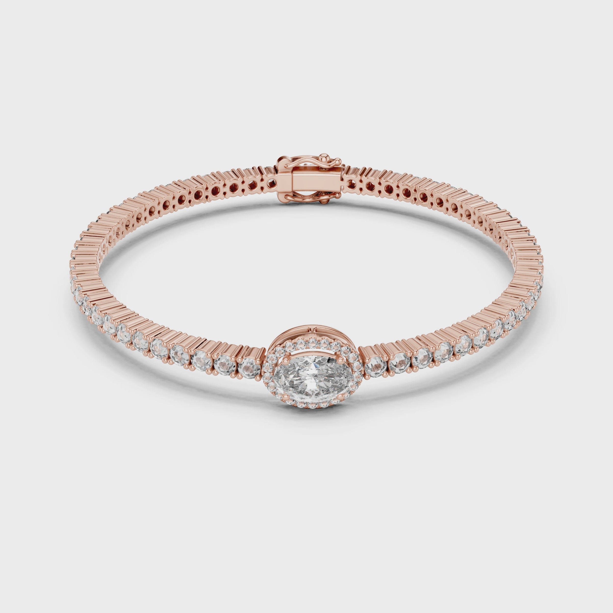 Rose gold bracelet with diamonds on a white surface, is rotating parallel to the surface to show its view from every side.