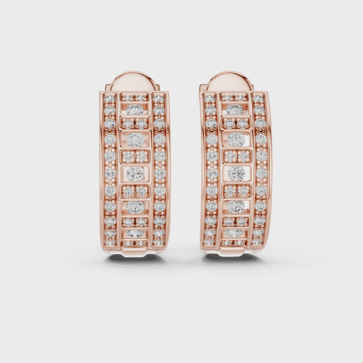 Rose gold hoop earrings with pavé-set clear stones, shown in front and side views on a clean white background and rotating horizontally to the surface.