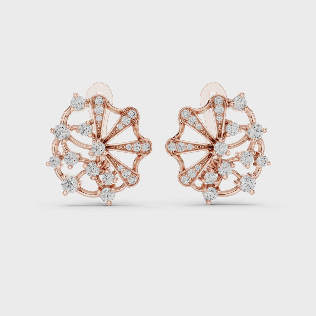 Rose gold stud earrings with diamond accents, are rotating horizontally to the white surface on a clean white background.