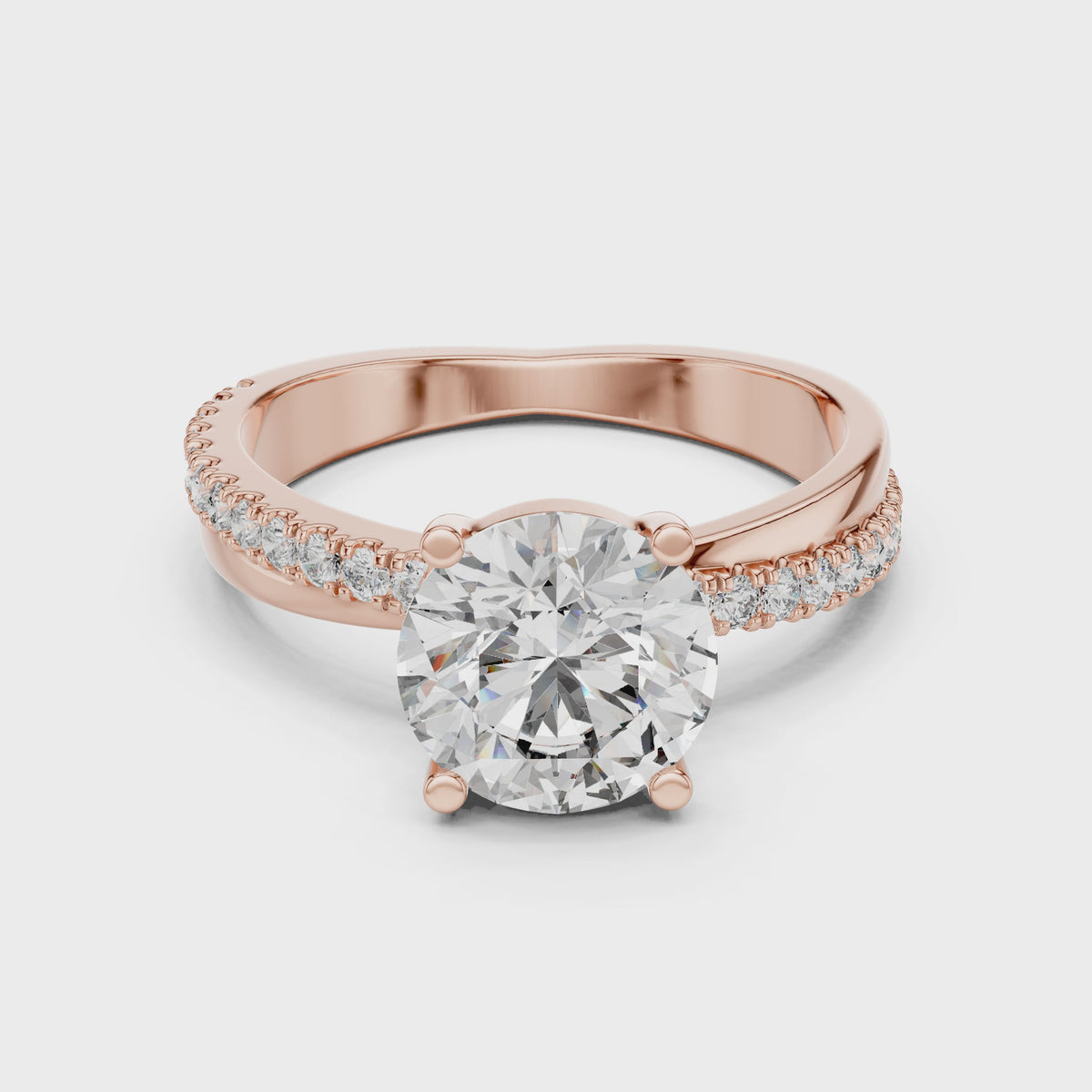 Rose gold ring with a large diamond and smaller diamonds on the band against a white background is rotating horizontally to the surface.