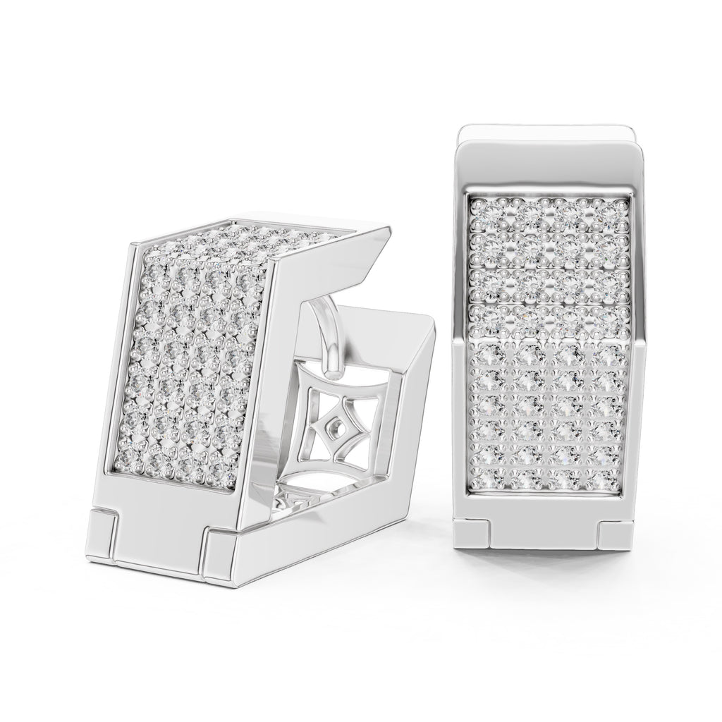 Pair of white gold earrings with clear diamonds on a white background
