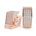 Rose gold earrings with diamond accents on a white background