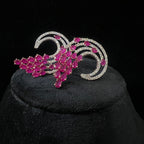 diamond stud earrings with pink gemstones on a black background