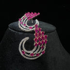 diamond earrings with pink gemstones on a black stand