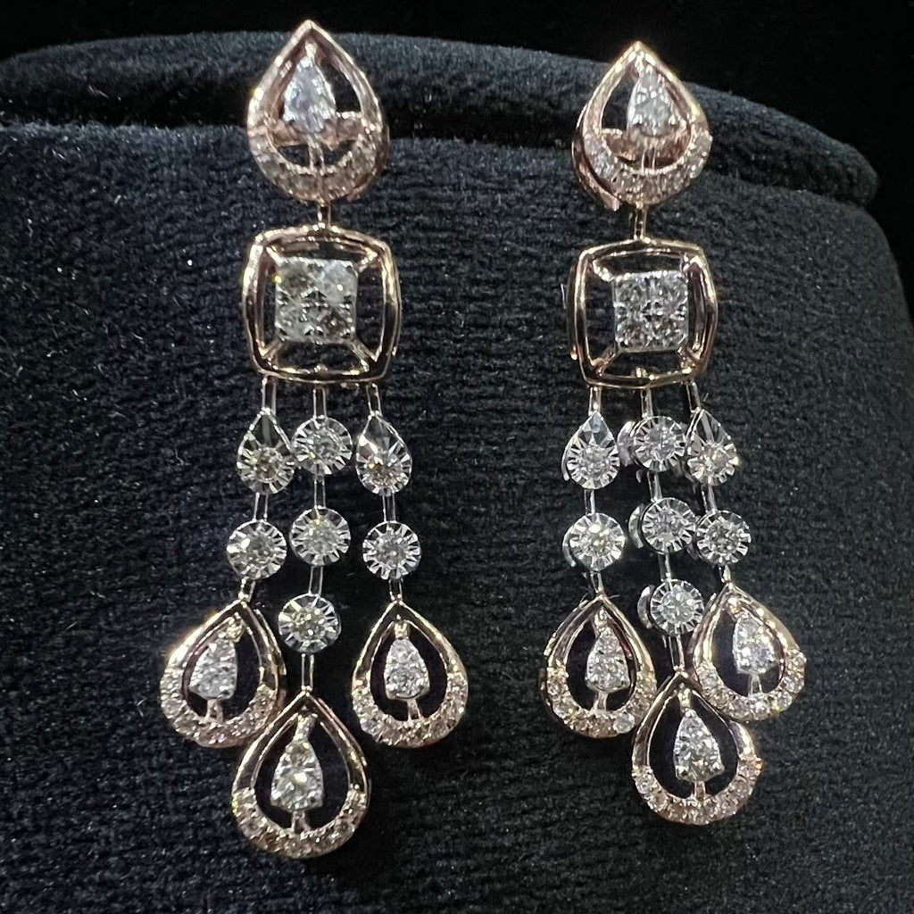 Pair of diamond earrings on a black background