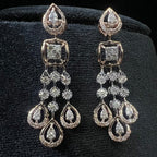 Pair of diamond earrings on a black background
