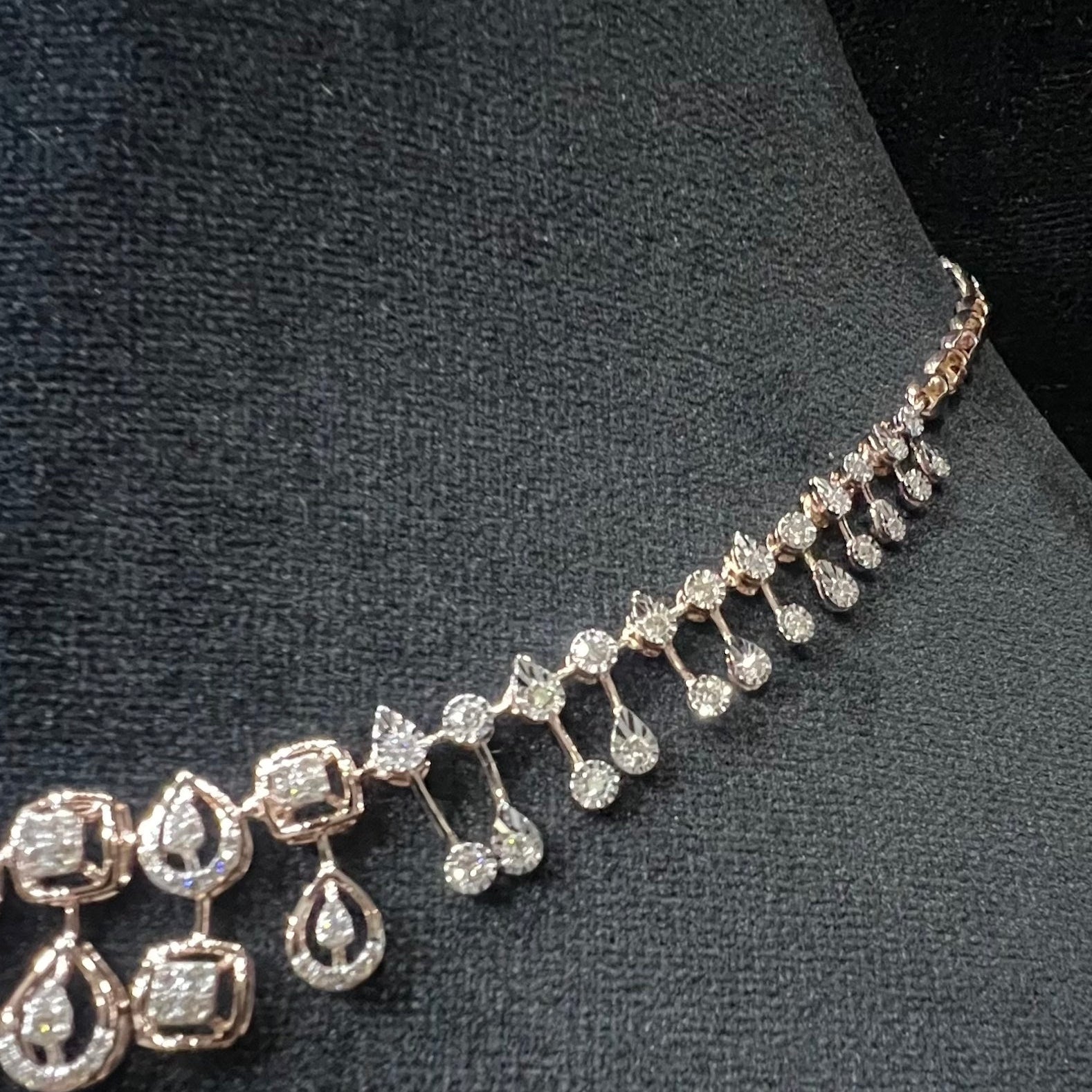 Diamond necklace on a dark fabric background