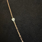 Gold chain necklace with a diamonds on a black background