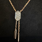 Necklace with a diamond pendant on a black background