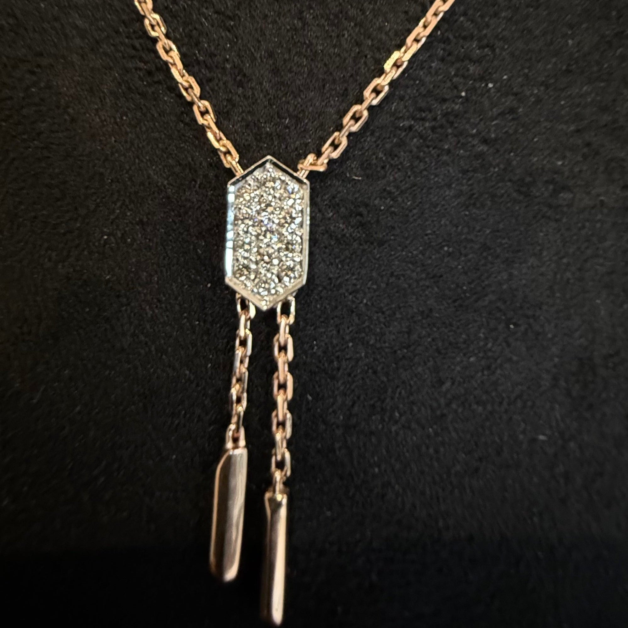 Necklace with a diamond pendant on a black background