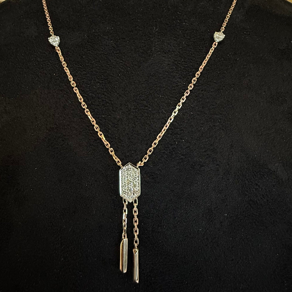 Diamond necklace with a decorative pendant on a black background