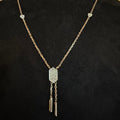 Diamond necklace with a decorative pendant on a black background
