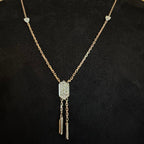 Diamond necklace with a decorative pendant on a black background